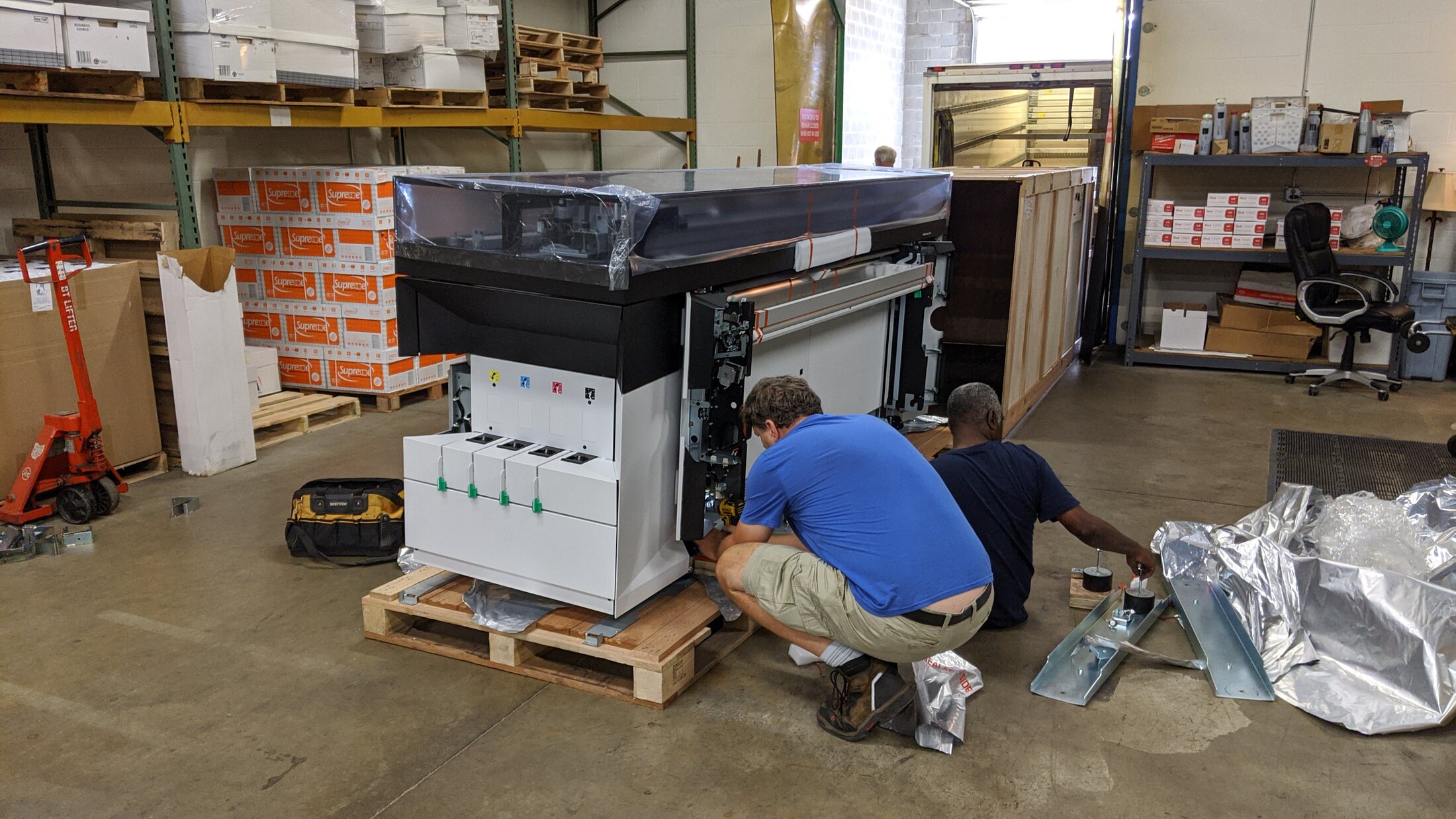 AA Blueprint technician installing wide-format production equipment